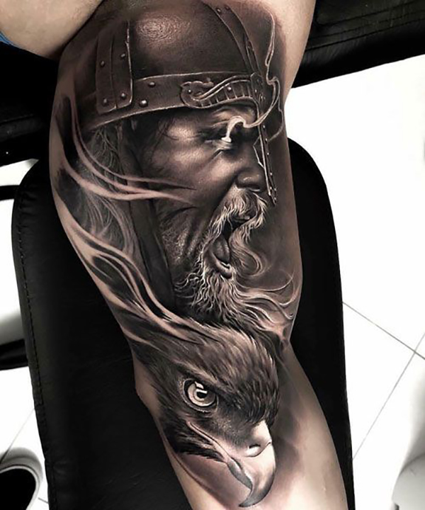 Viking with Glowing Eyes Over Bird Inner Bicep Tattoo Tattoo on skin