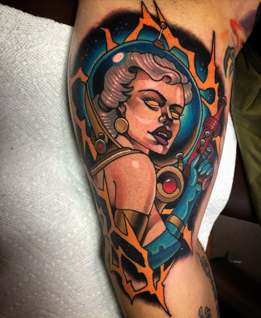 Woman in Space Helmet with Ray Gun Inner Bicep Tattoo Ideas Tattoo on skin