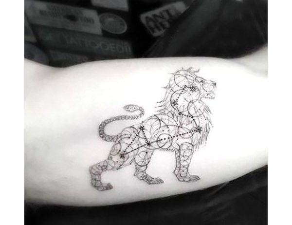 Leo Constellation Bicep Tattoo Ideas with Lion Tattoo on skin