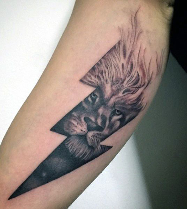 Lion Face Within a Lightning Bolt Bicep Tattoo Ideas Tattoo on skin