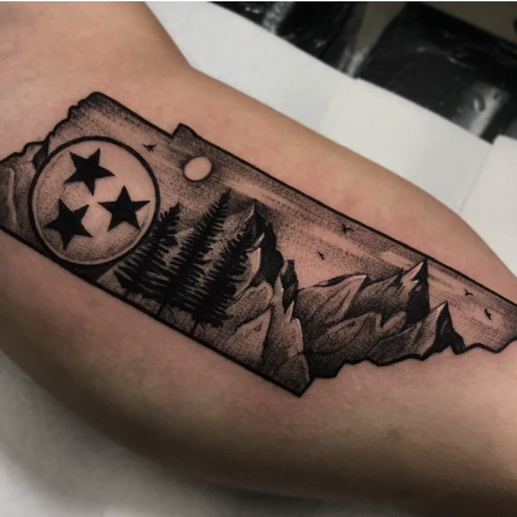 Tennessee Filled with Scenery and an Orb Inner Bicep Tattoos Tattoo on skin