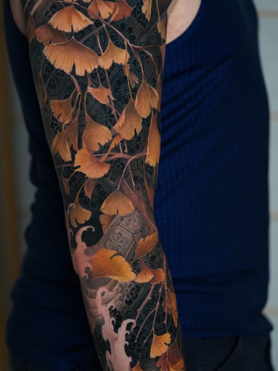 Beautiful Floral Biceps Tattoo with Ginkgo Leaves Tattoo on skin