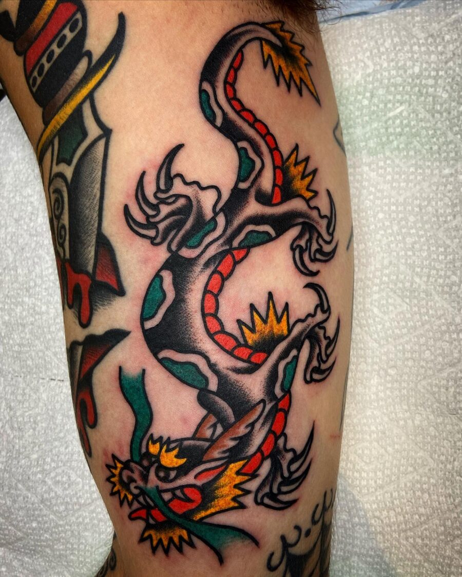 Bold dragon tattoo design on biceps Tattoo on skin