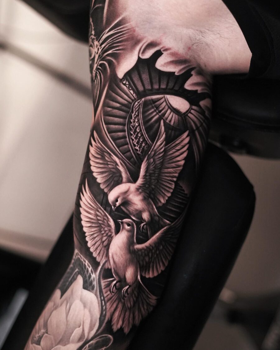 Elegant black and gray bird tattoo design Tattoo on skin