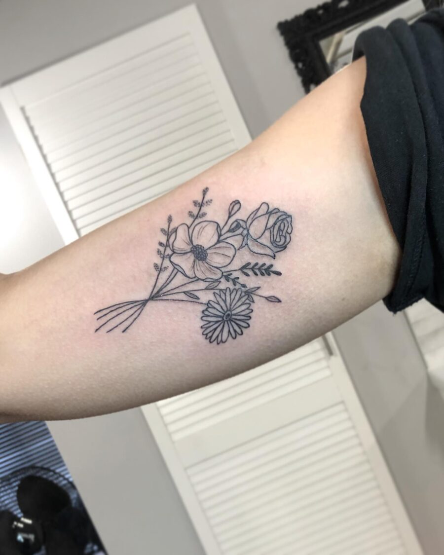 Elegant floral design for bicep tattoos Tattoo on skin