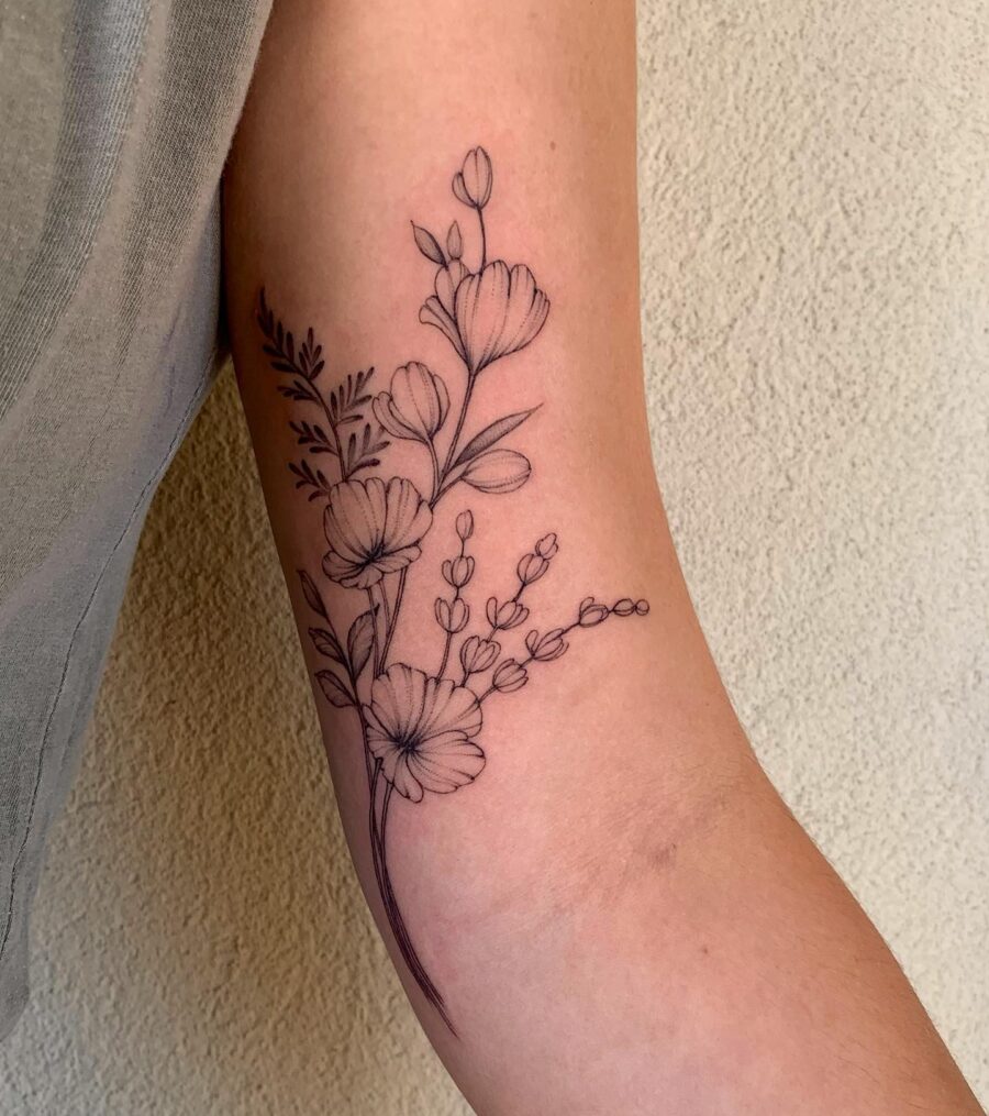 Elegant floral design for bicep tattoos Tattoo on skin