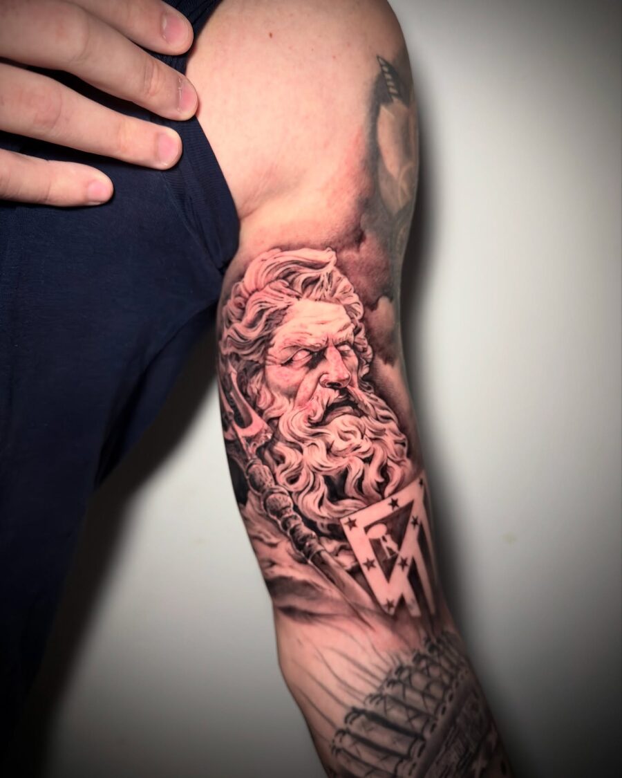 Epic Greek god tattoo on muscular bicep Tattoo on skin