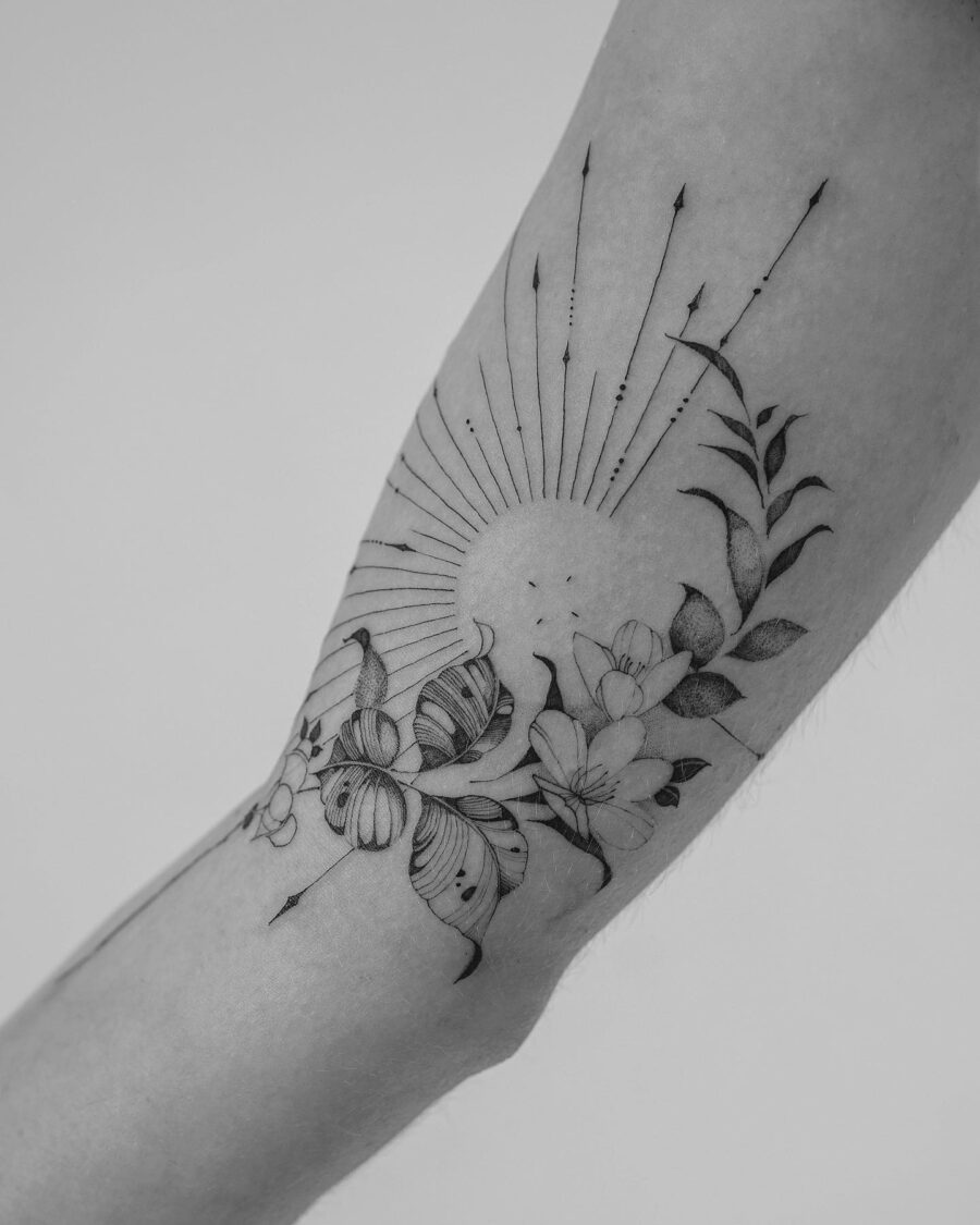 Stunning floral and sunray biceps tattoo design Tattoo on skin