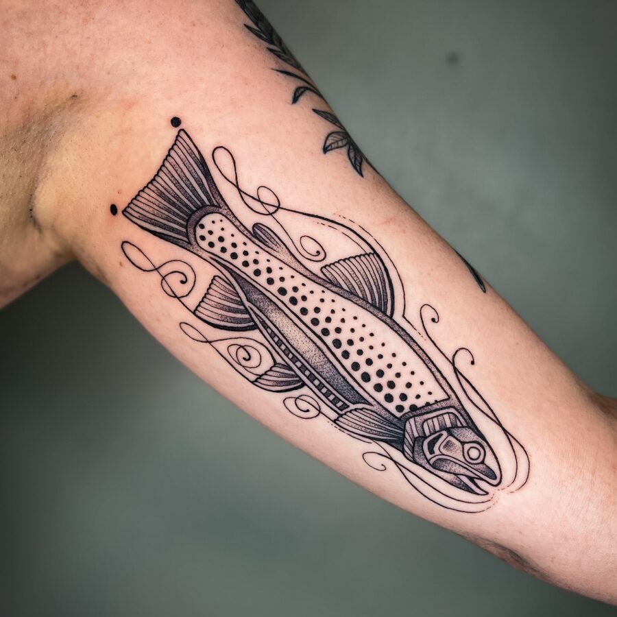 Stylish fish tattoo enhancing arm aesthetics Tattoo on skin