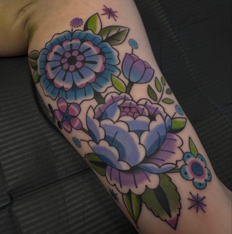 Vibrant floral biceps tattoo design for aesthetics Tattoo on skin