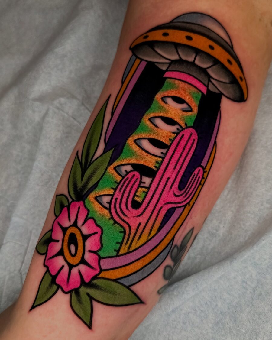Vibrant UFO Tattoo with Floral Elements Tattoo on skin