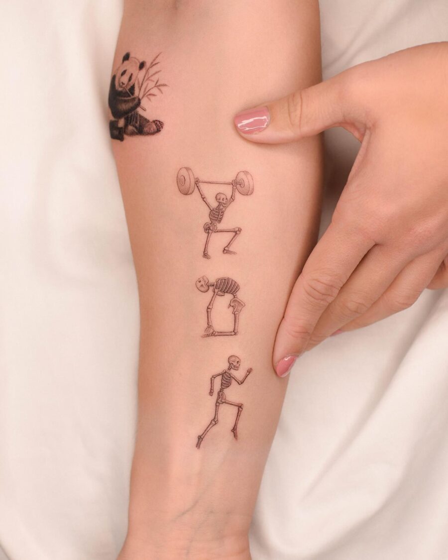 Whimsical Biceps Tattoo Art Featuring Skeletons Tattoo on skin