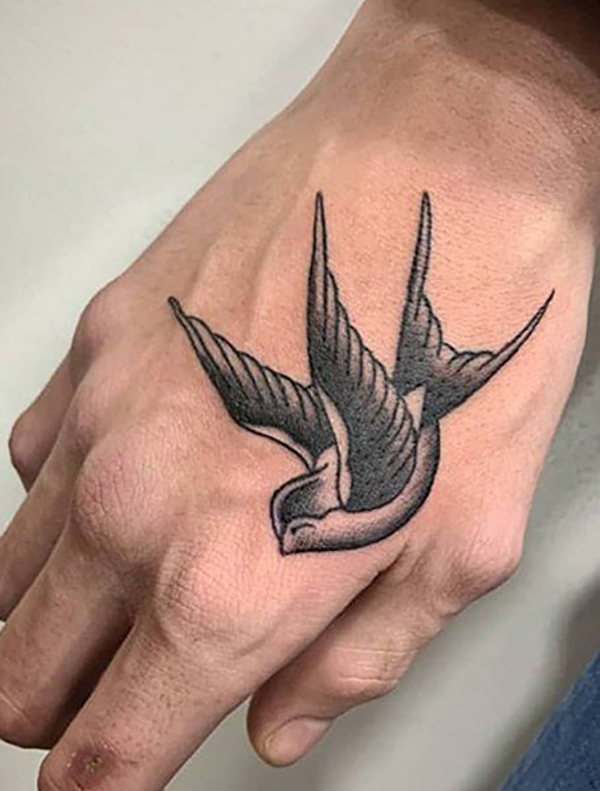 Black and White Swallow Hand Tattoo Tattoo on skin