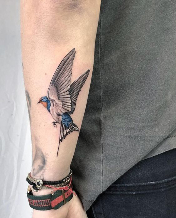 Blue Bird in Flight Tattoo on Forearm Tattoo on skin