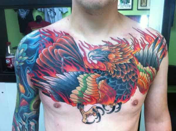 Boldly Colored Phoenix Chest and Shoulder Tattoo Tattoo on skin