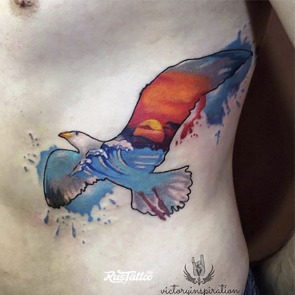 Eagle in Sky Tattoo in Watercolor Style Tattoo on skin