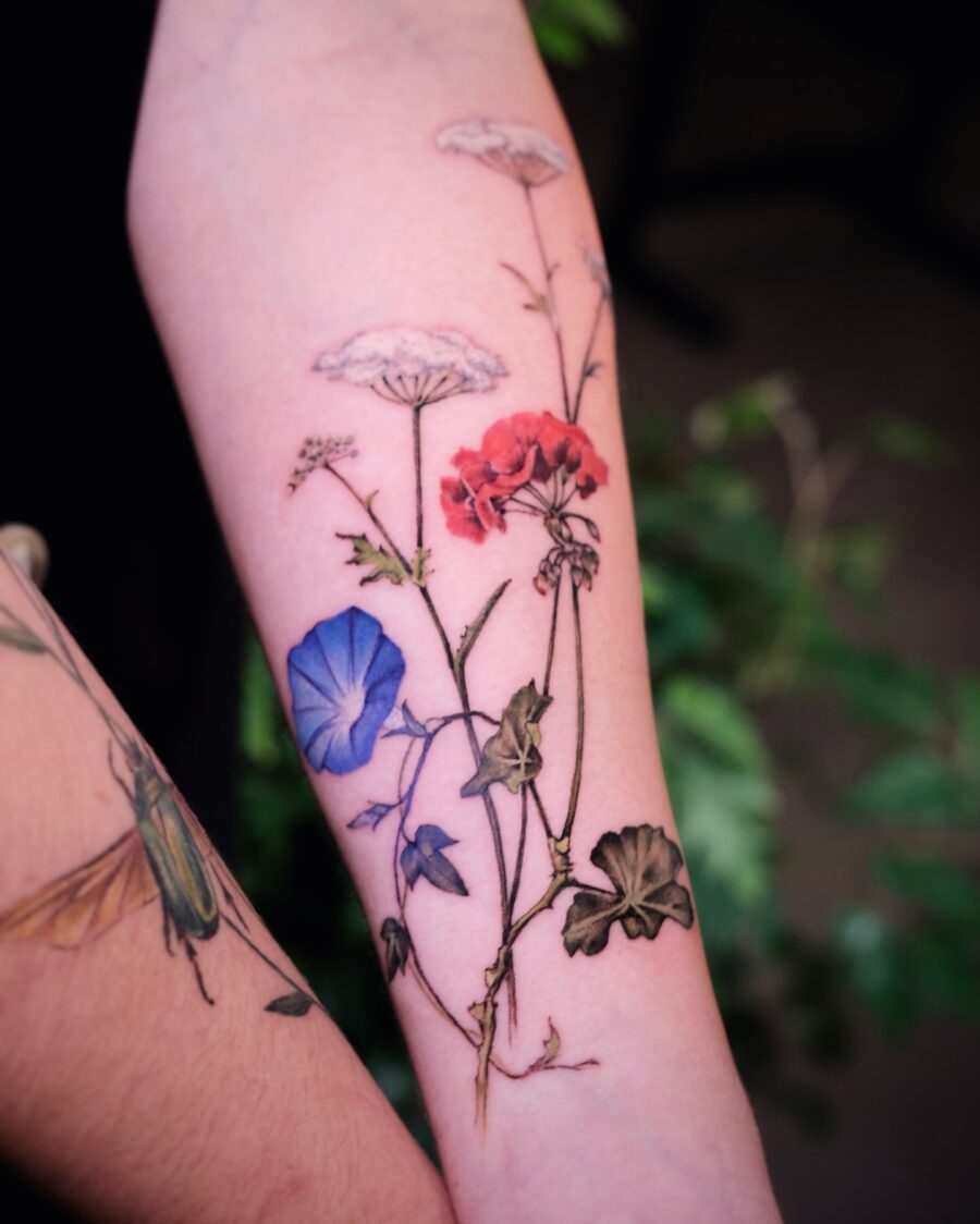 A vibrant display of birth flower tattoos Tattoo on skin