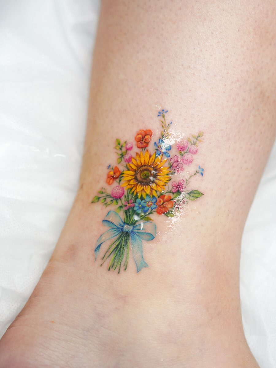 Bright and cheerful sunflower bouquet tattoo art Tattoo on skin