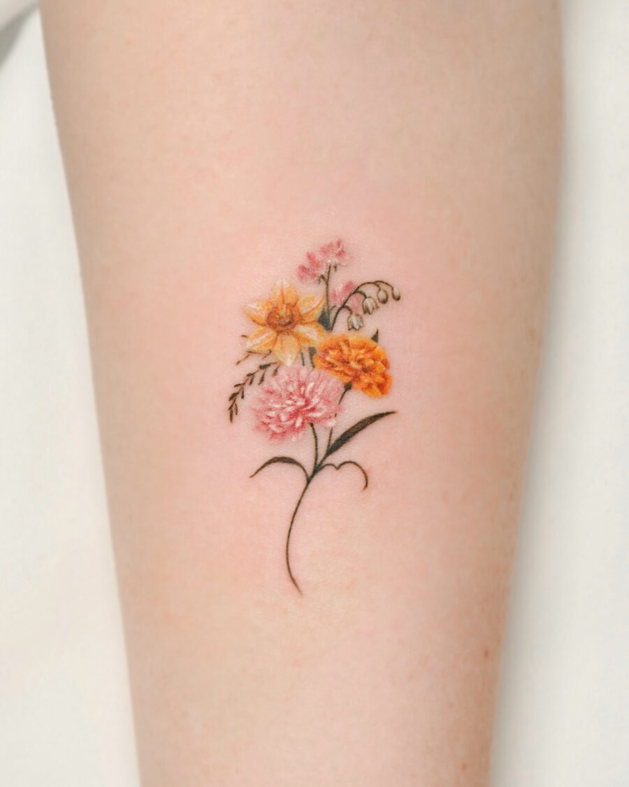 Colorful birth flower tattoo with delicate details Tattoo on skin