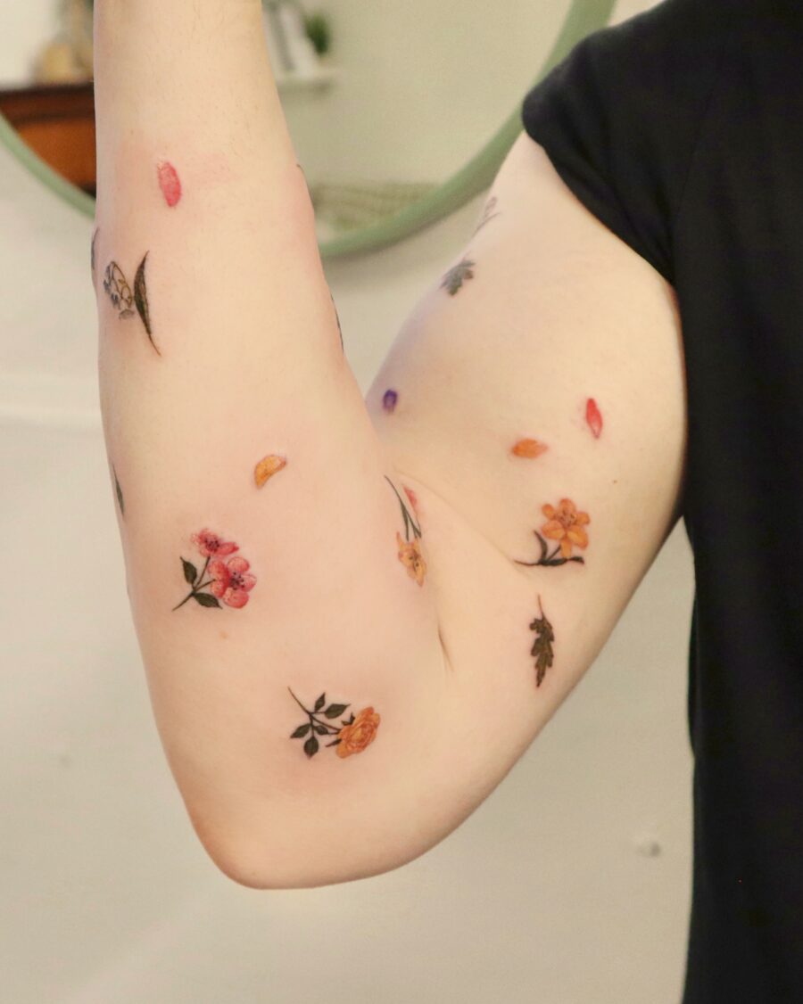 Colorful floral tattoos on the arm Tattoo on skin