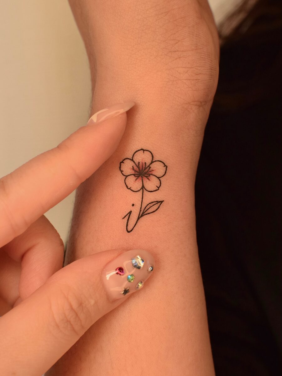 Delicate flower tattoo with elegant linework Tattoo on skin