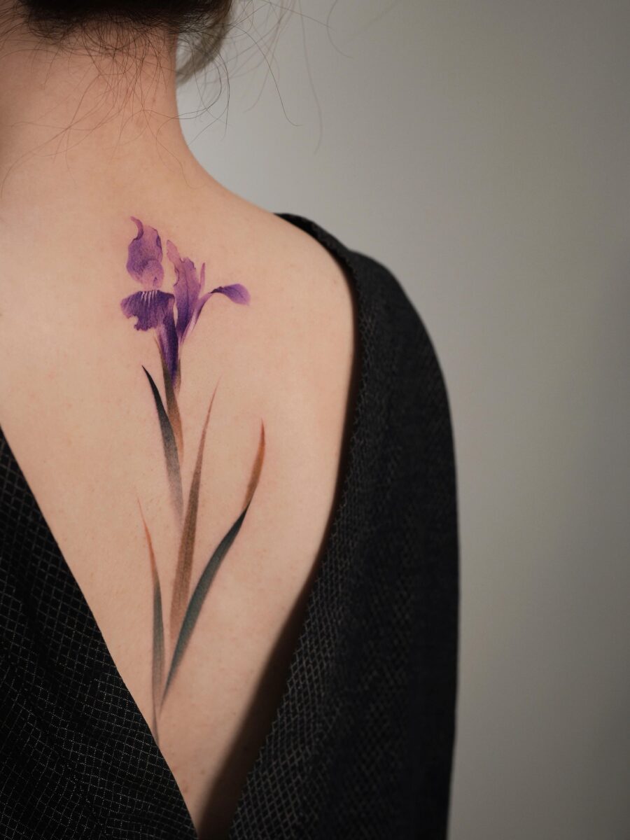 Stunning iris tattoo for flower enthusiasts Tattoo on skin