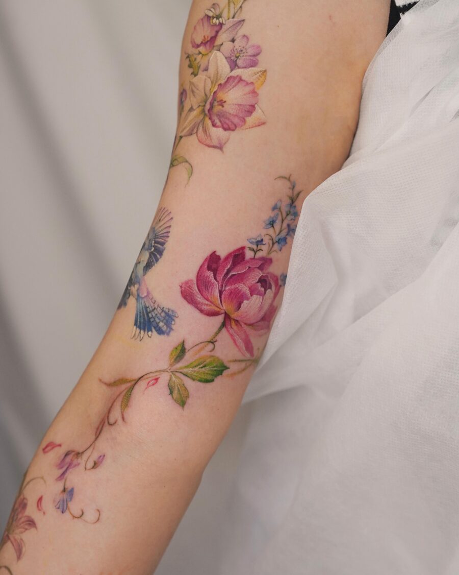 Vibrant birth flower tattoo showcasing floral beauty Tattoo on skin