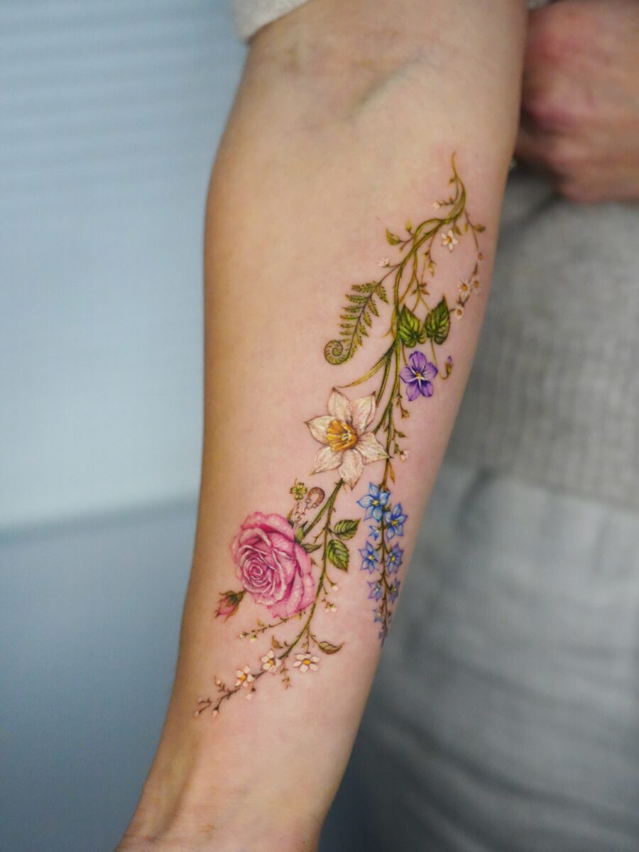 Vibrant Floral Birth Flower Tattoo on Arm Tattoo on skin