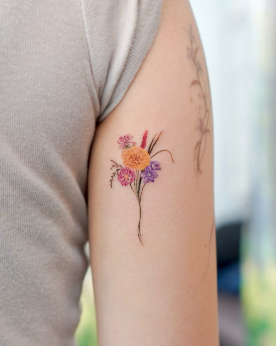 Vibrant floral birth flower tattoo on skin Tattoo on skin