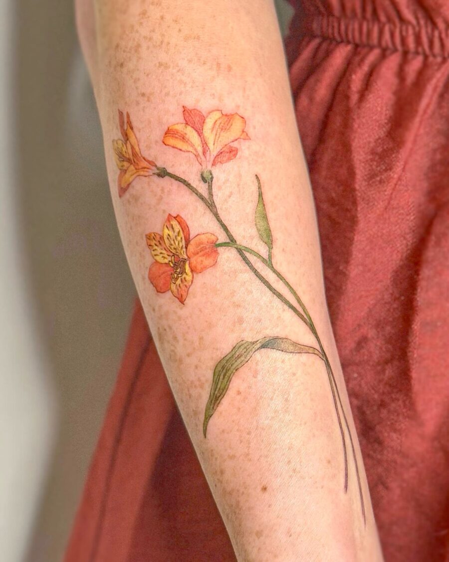 Vibrant floral tattoo on forearm Tattoo on skin