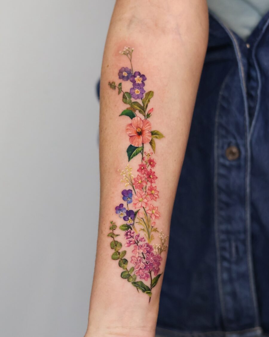 Vibrant floral tattoo with colorful blossoms birth flower tattoos