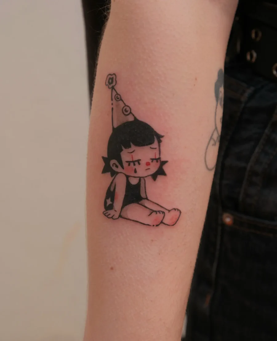 Charming birthday-themed character tattoo design Tattoo on skin