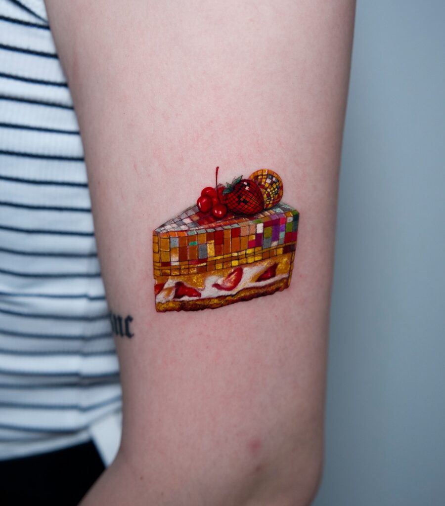 Colorful cake slice birthday tattoo design Tattoo on skin