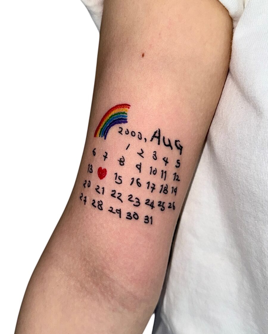 Colorful calendar tattoo celebrating a special date Tattoo on skin