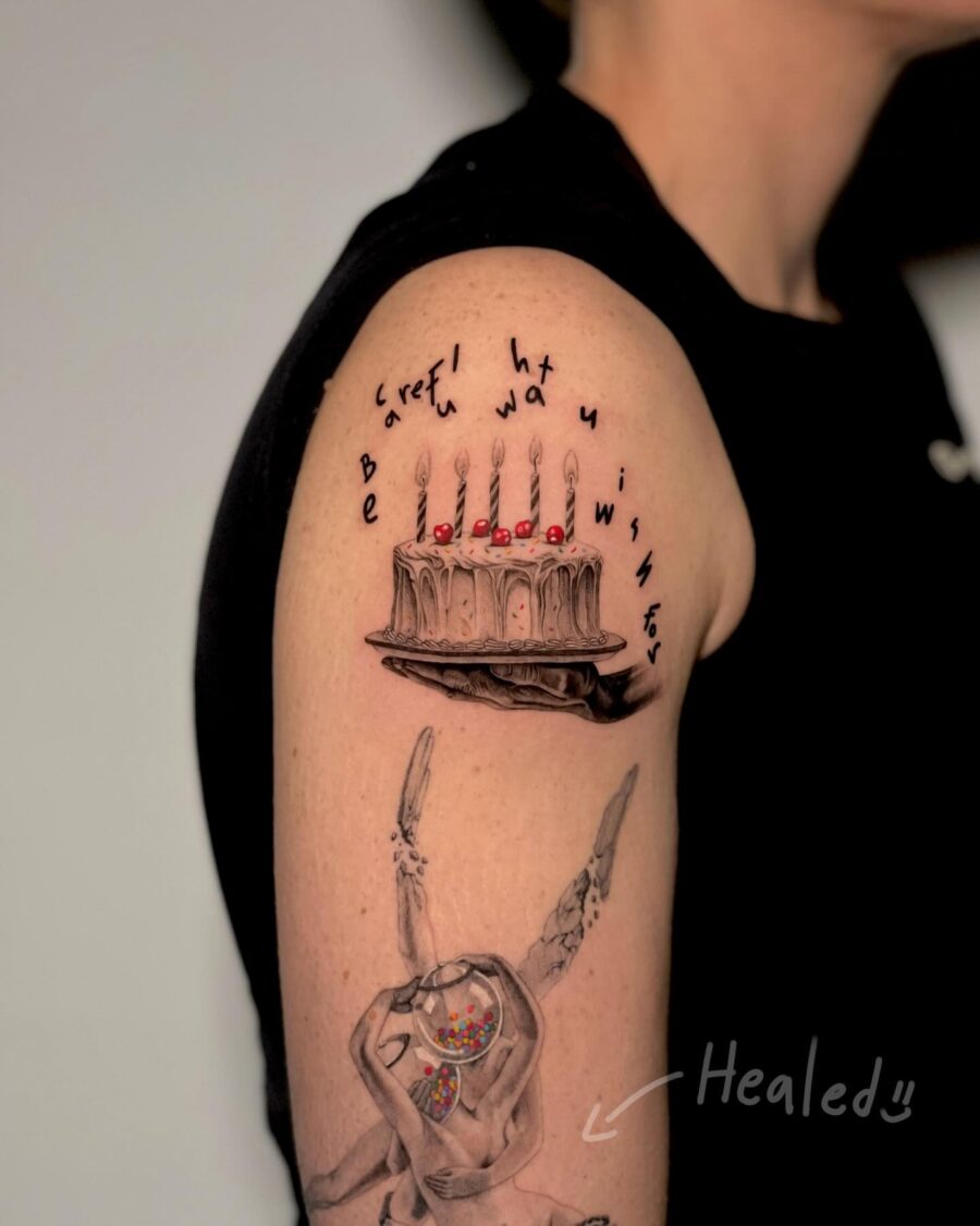 Creative birthday tattoo celebrating wishes and cake Tattoo on skin