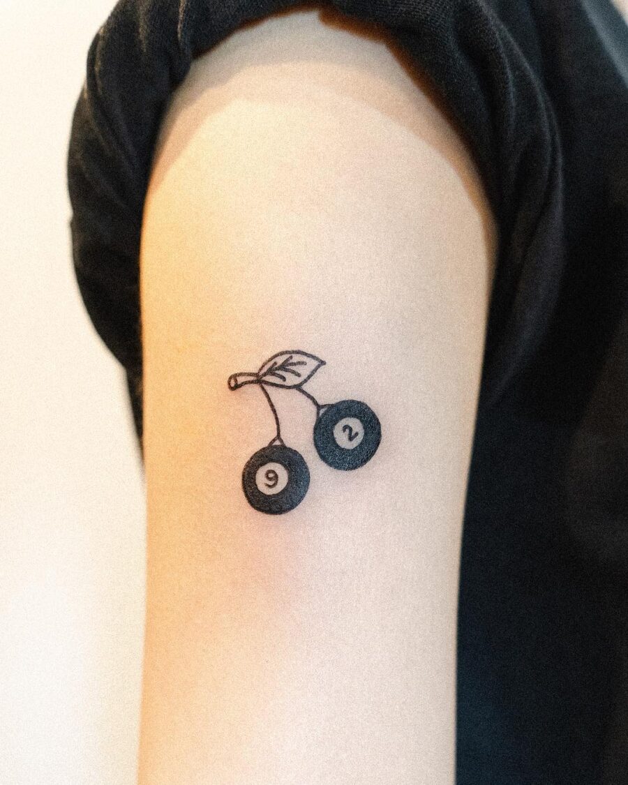 Minimalistic cherry tattoo celebrating a birthday birthday tattoos