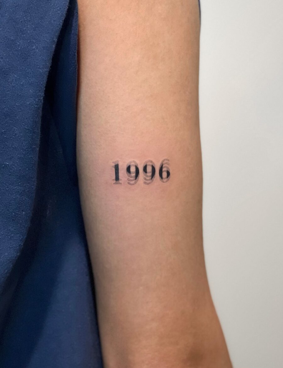 Stylish year tattoo for personal significance Tattoo on skin
