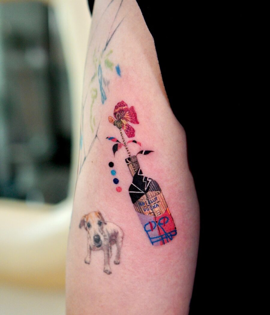Whimsical birthday tattoo with playful elements Tattoo on skin