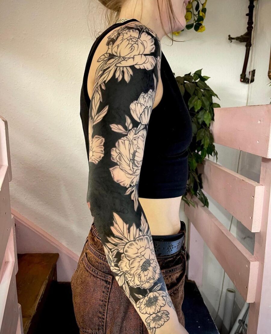 Elegant black floral sleeve tattoo design Tattoo on skin
