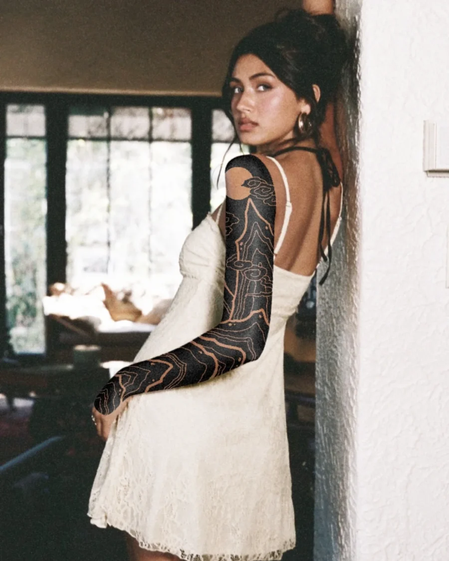 Elegant black sleeve tattoo on stylish model Tattoo on skin