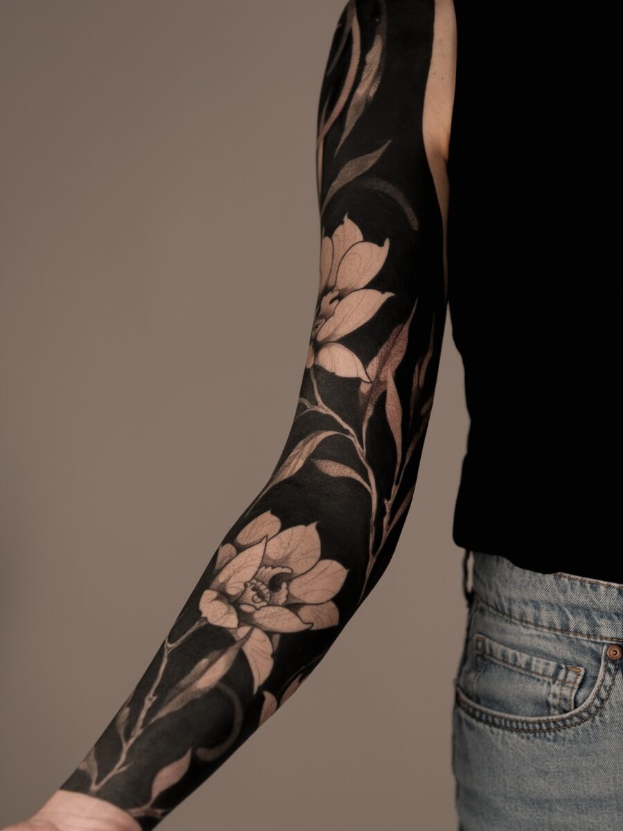 Elegant floral black sleeve tattoo design Tattoo on skin