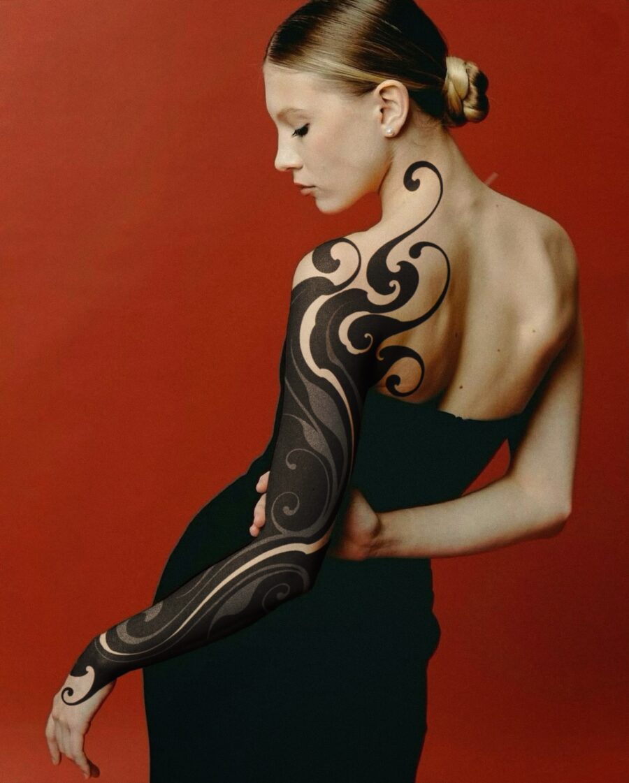 Elegant swirling black sleeve tattoo design Tattoo on skin