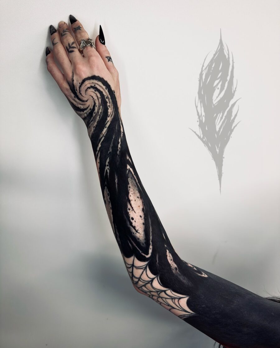 Intricate black sleeve tattoo with swirling design black sleeve tattoos