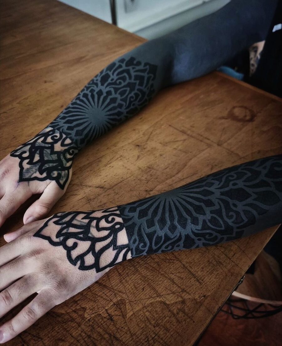 Intricate patterns define this striking sleeve tattoo Tattoo on skin
