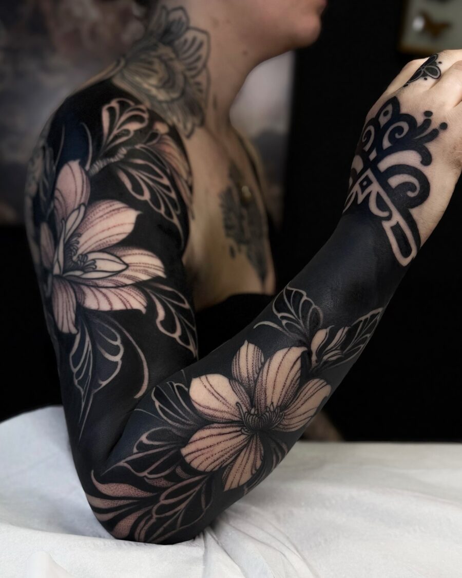 Stunning black floral sleeve tattoo detail Tattoo on skin