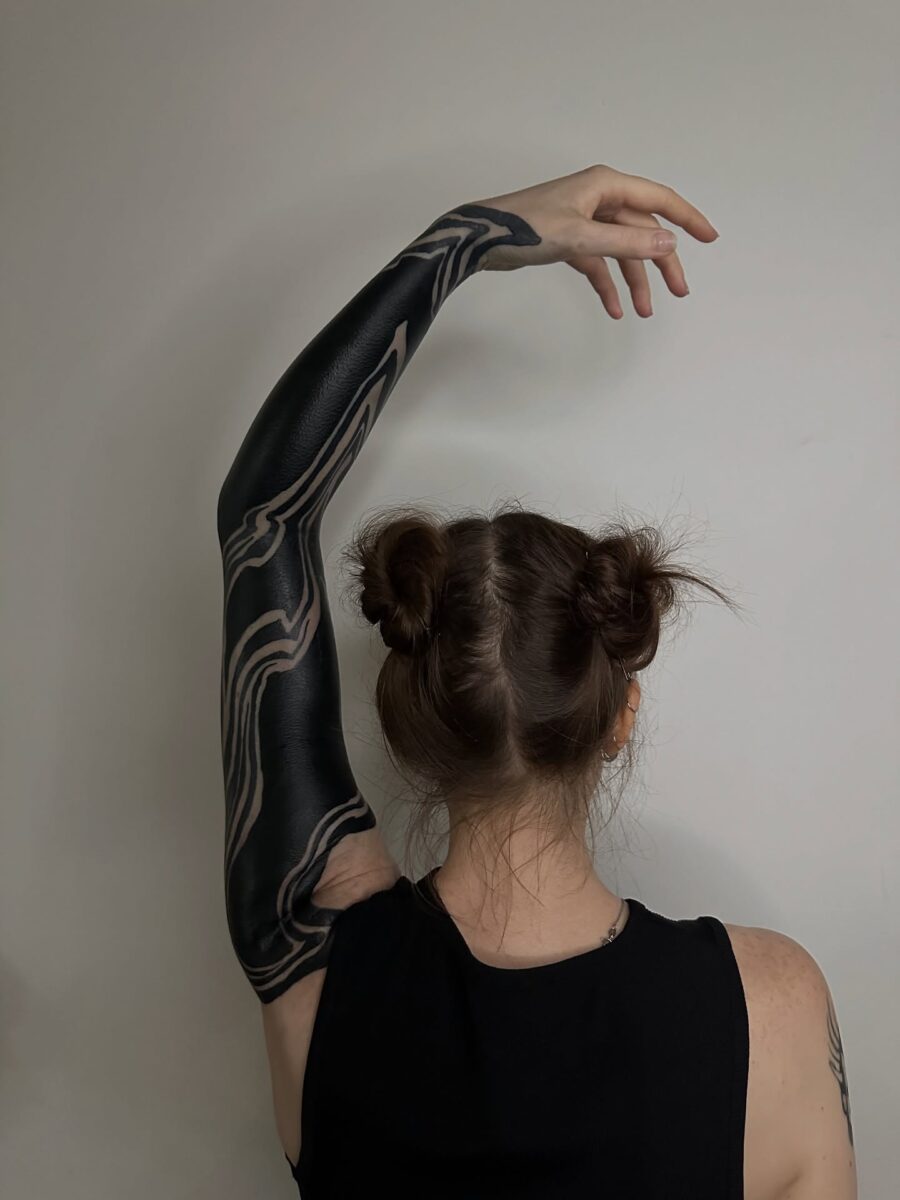 Stunning black sleeve with abstract patterns Tattoo on skin