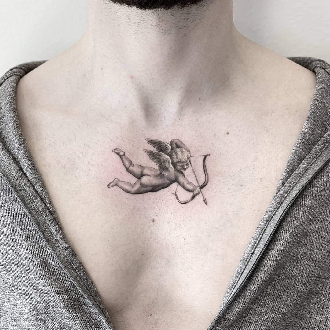Renaissance Inspired Tattoo Dimensional Grayscale Cherub Arrow Tattoo Tattoo on skin