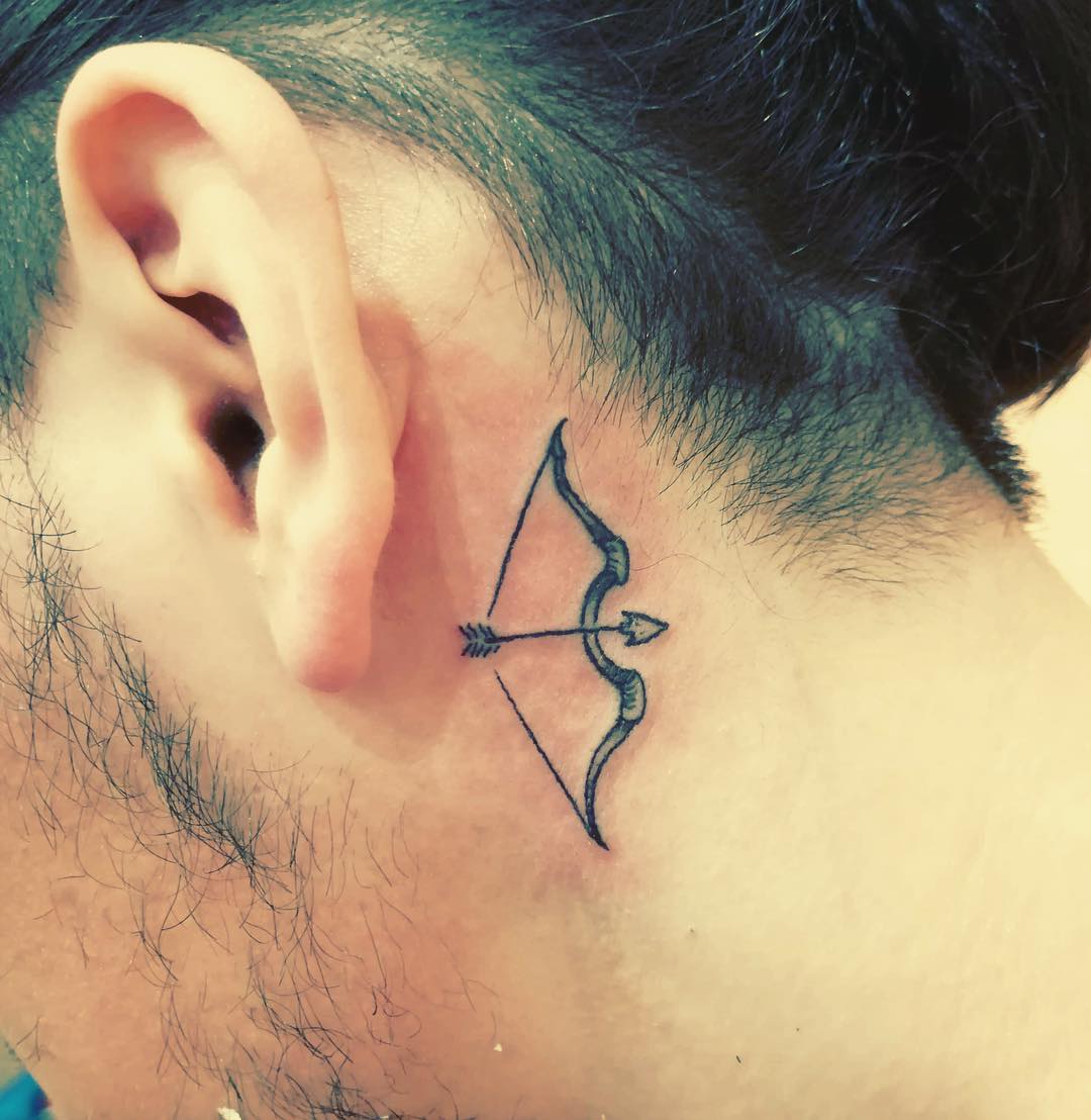Work Friendly Tattoo Behind the Ear Bow Arrow Tattoo Tattoo on skin