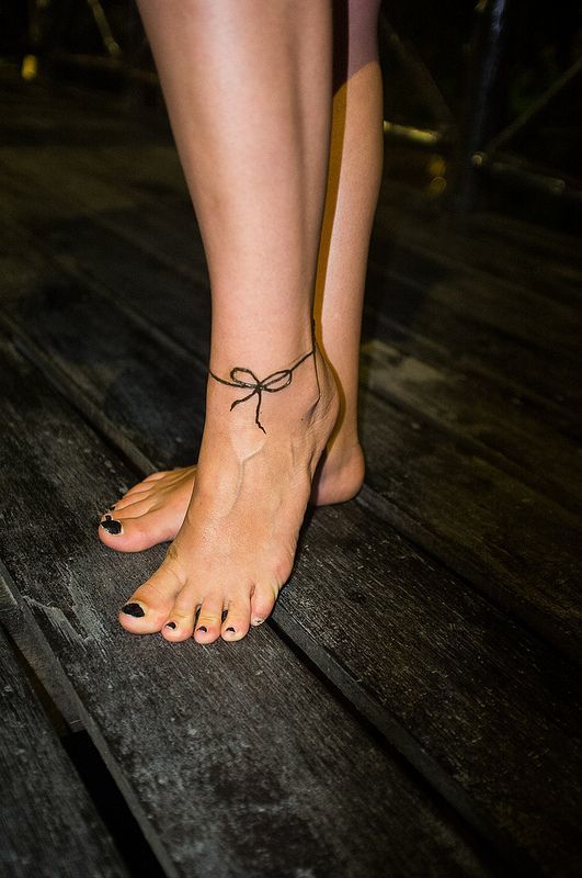 Bow tattoos for survivors Tattoo on skin