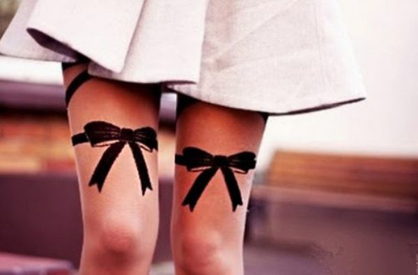 Tattooed bows on neck Tattoo on skin